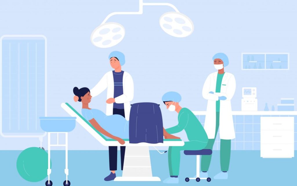 woman giving birth surrounded by 3 doctors