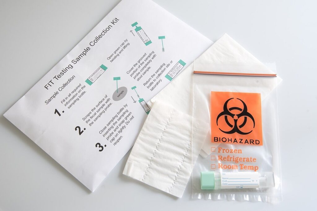 instructions for FIT colorectal cancer test next to biohazard bag