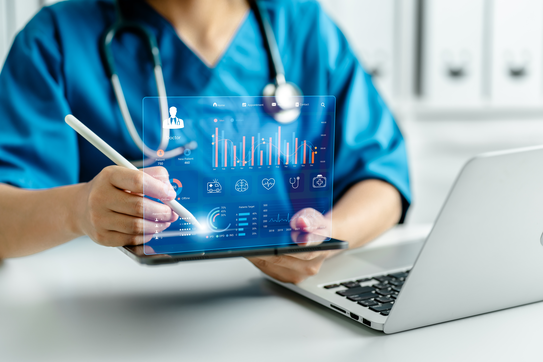nurse holding tablet up with statistics on it, representing ai nurse staffing 